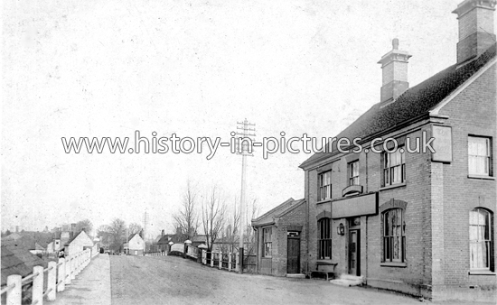 The Railway Tavern and Bridge, High Street, Kelvedon, Essex. c.1906.